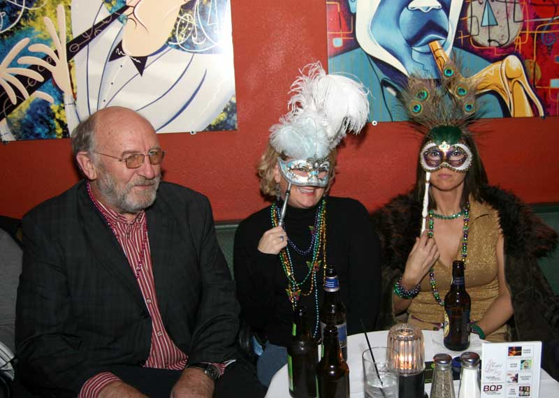 John Hill of the Broad Ripple Brew Pub with two lovely ladies hiding behind masks. (I sure hope one of them is Nancy!)