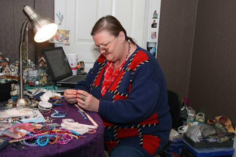 Maxine George making a necklace at Fairystone.