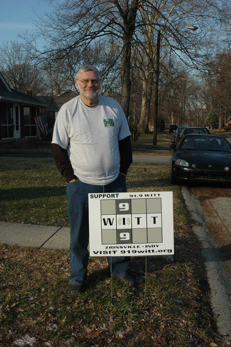Jim Walsh with one of his WITT 91.9 yard signs.