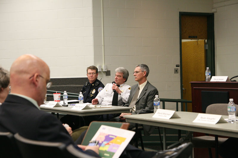 North District Major David Allender from Indianapolis Metropolitan Police Department listened as Fire Chief Jim Greeson from Indianapolis Fire Department discussed the narrow streets of the Village.