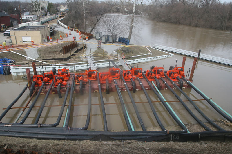A view of the system of pumps to move the water up and over the Westfield bridge to keep the canal flowing during the construction.