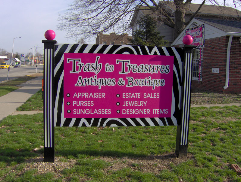 The familiar pink sign at Trash To Treasures.