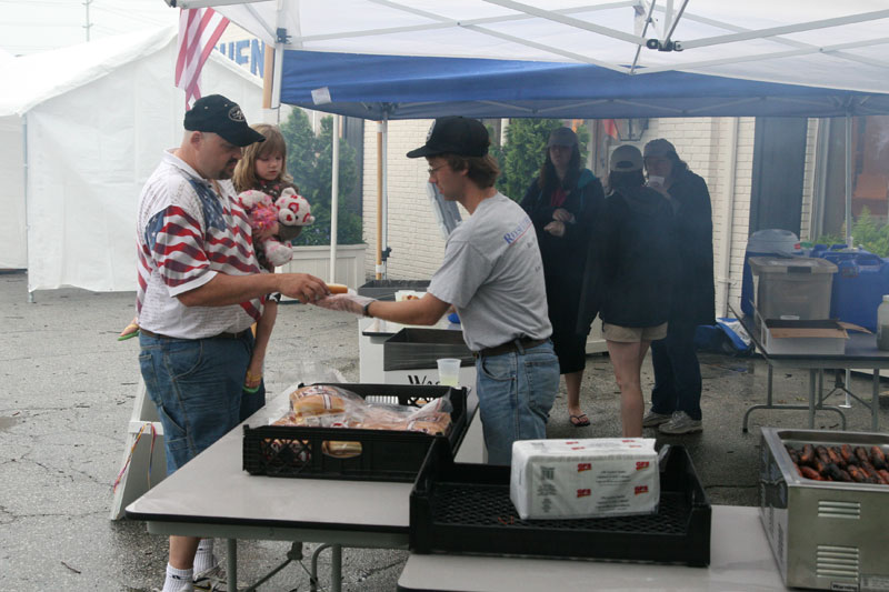 Free hotdogs still taste great in the rain.