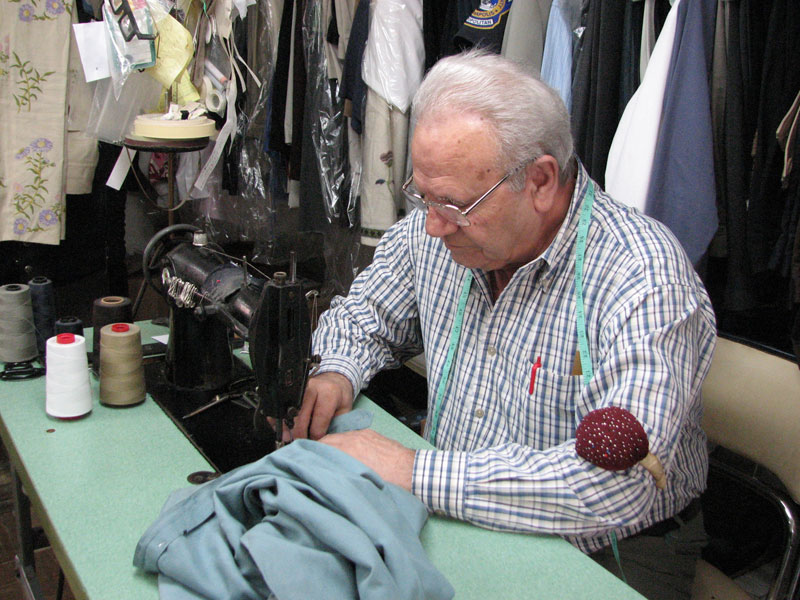 John Anagnostou working on an alteration at United Repair Service