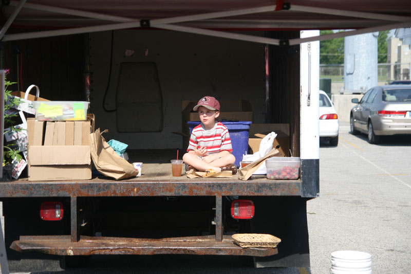 One youngster enjoyed the market from the back of a truck
