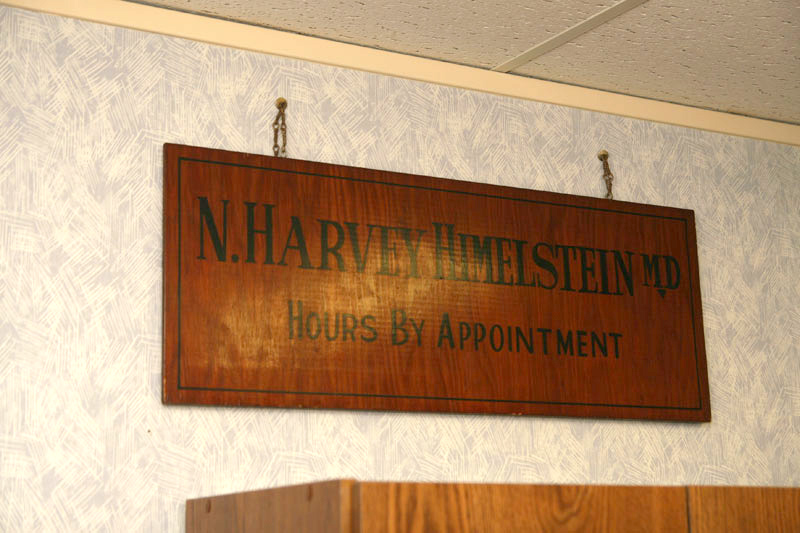 Dr. Himelstein's original sign hangs in his new office.