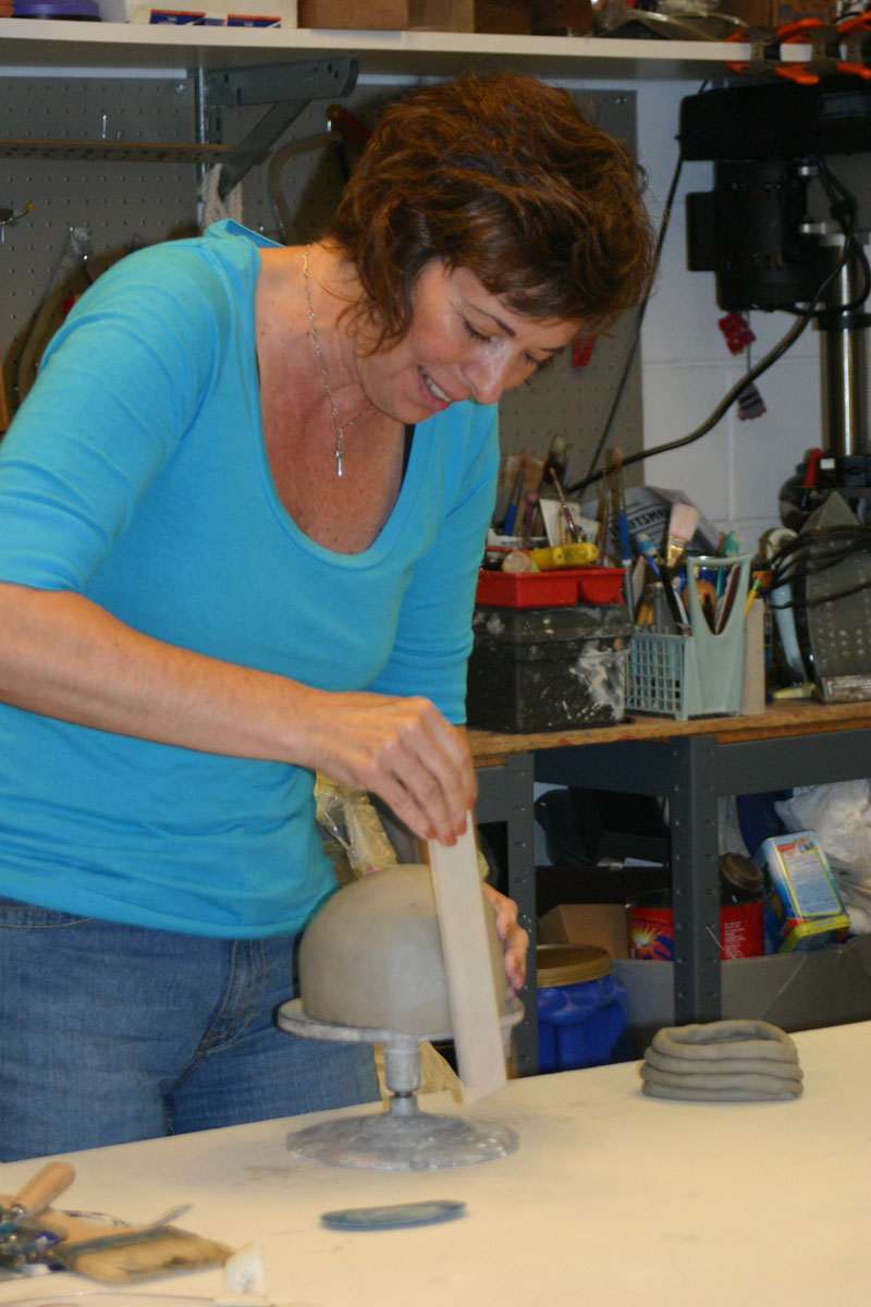 Morgen creating an urn in her studio.