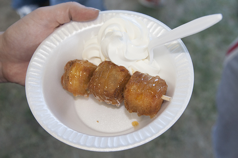 Deep-fried bananas foster cheesecake on a stick