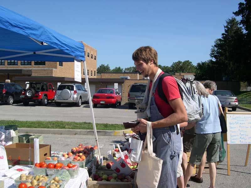 Jared Rust and the little dog in the pouch is Fawn and the big dog is Bontecou. Fawn was quite a hit at the Aug 16 market.