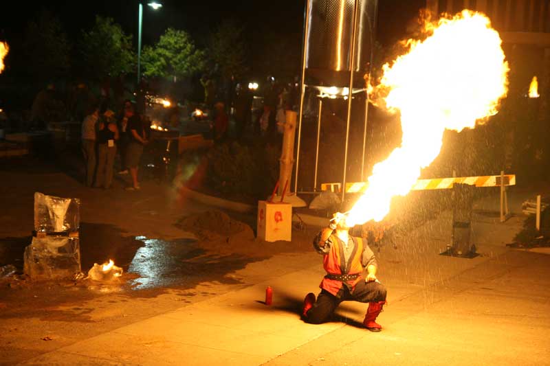 Fire magician Douglas Jave spitting a fireball