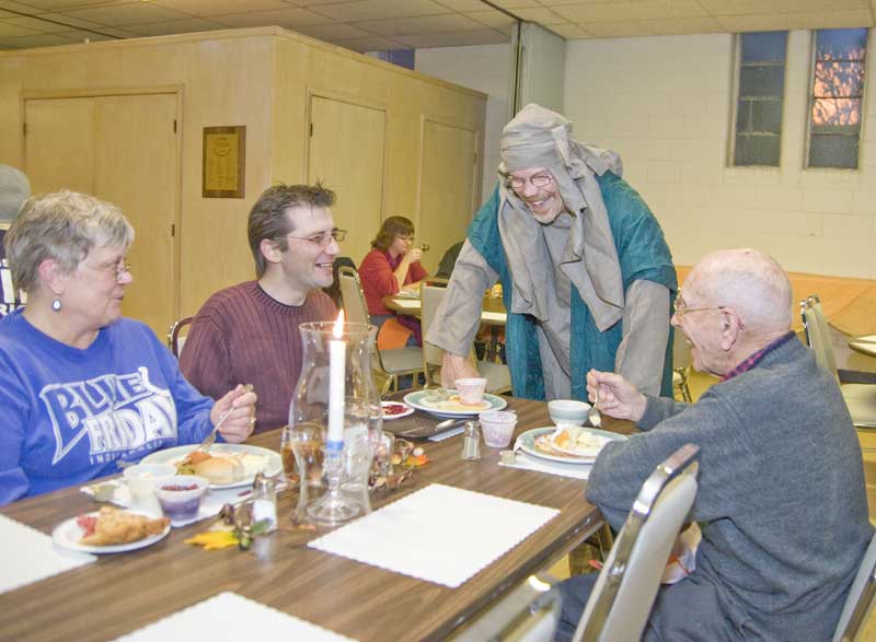 Reverend Tim Rasmussen, in costume, greeted guests and let them know about the live nativity event on December 6 from 5pm to 7pm.