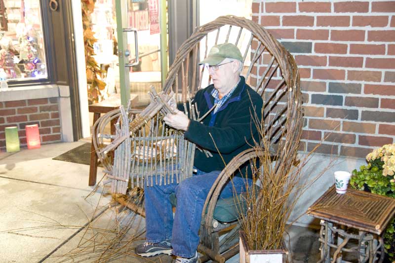 Greg Adams creating holiday decorations with willow.