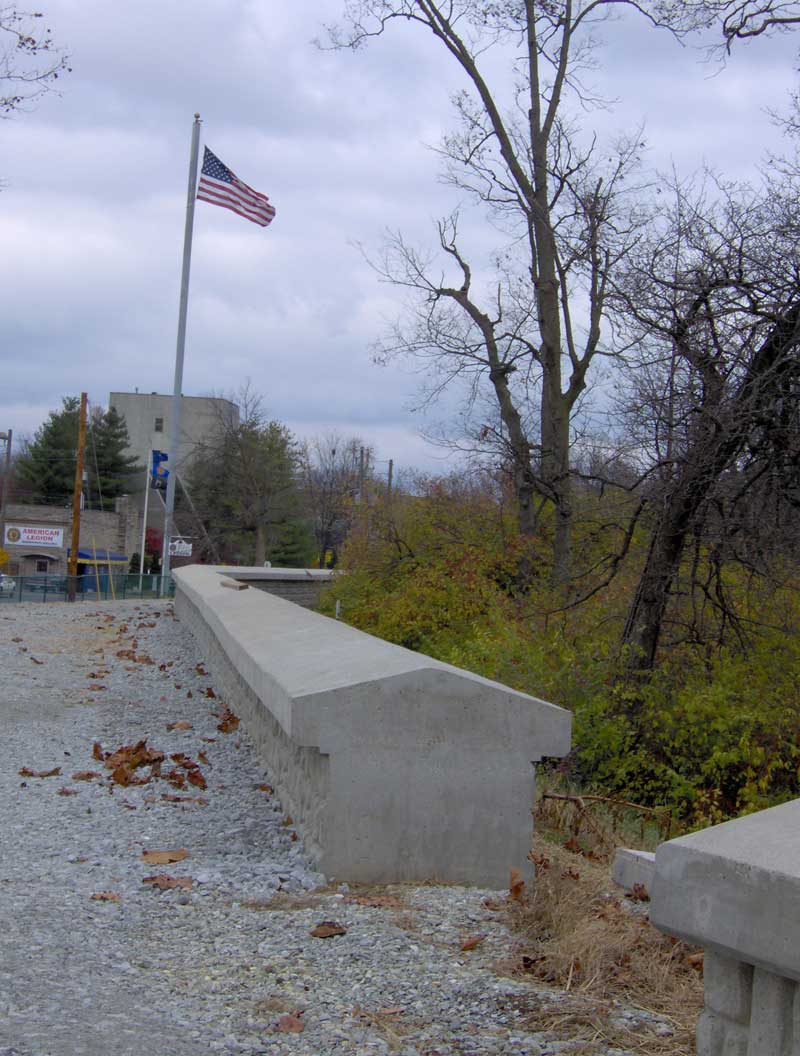 The levee wall along Westfield Boulevard. The American Legion Post can be seen in the distance.