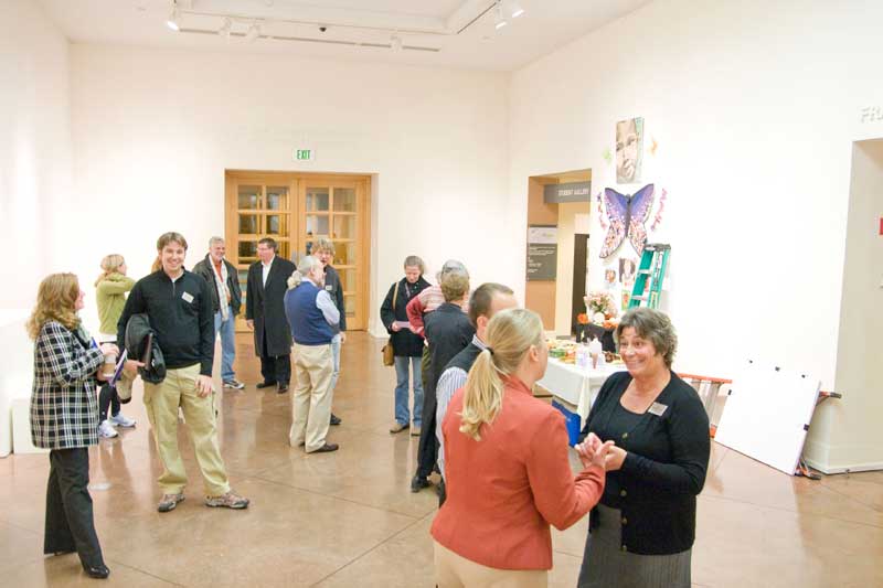 Ellen Morley Matthews greeted attendees in the Art Center gallery before the meeting.