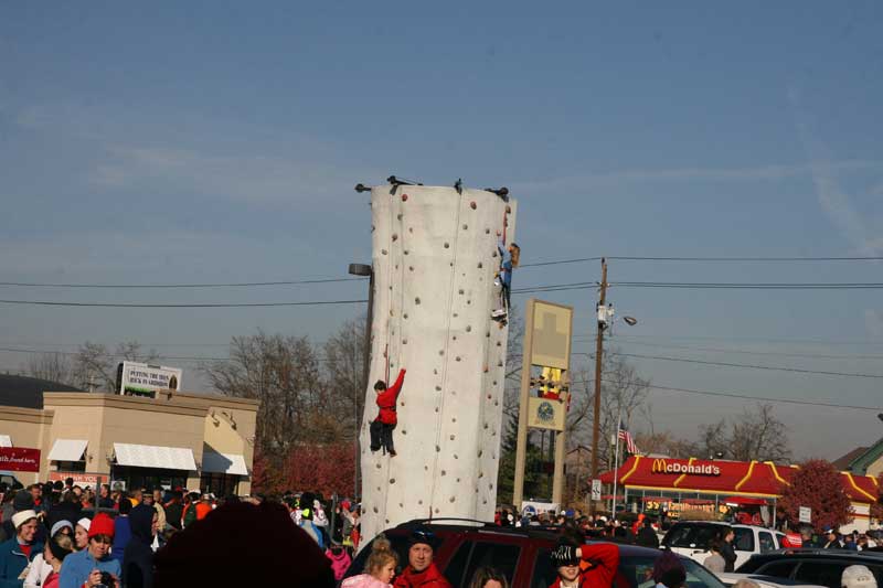 A wall climbing tower was set up in the Running Company parking lot.