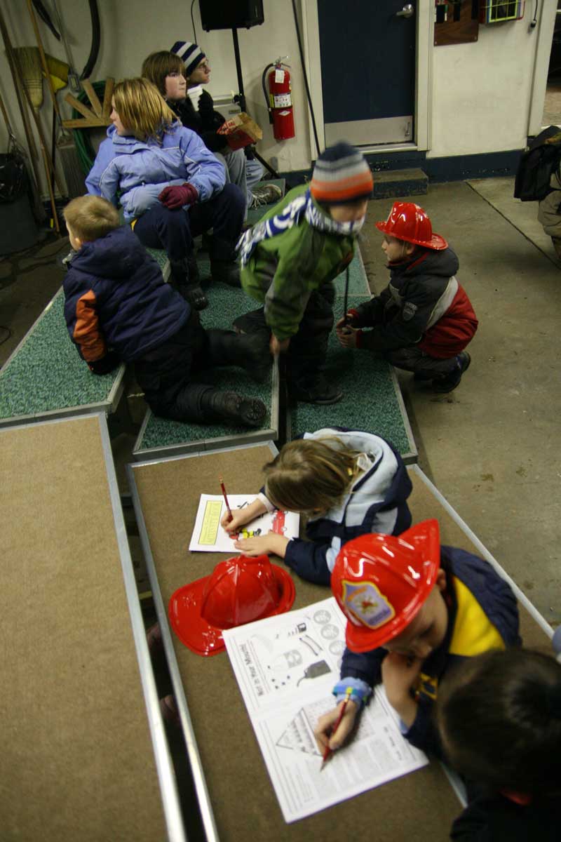 Kids received coloring books and helmets.