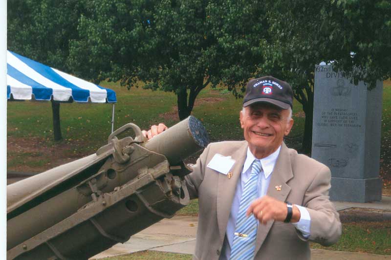 Mote demonstrates loading a 75 mm Howitzer.