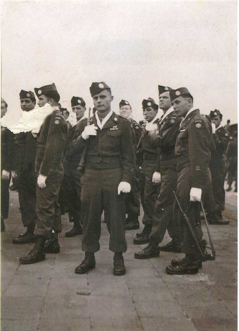 Richard Mote & fellow soldiers prepare to march in a parade.