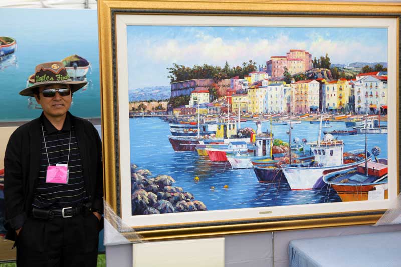 Artist Edward Park stands next to his stunning oil painting of Sorrento Harbor, Florida. He explained that the painting took about 3 weeks to create, 