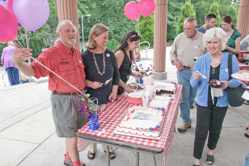 Michael Freeland, Sharon Butsch Freeland, and Elizabeth Shikany served cake at the party.