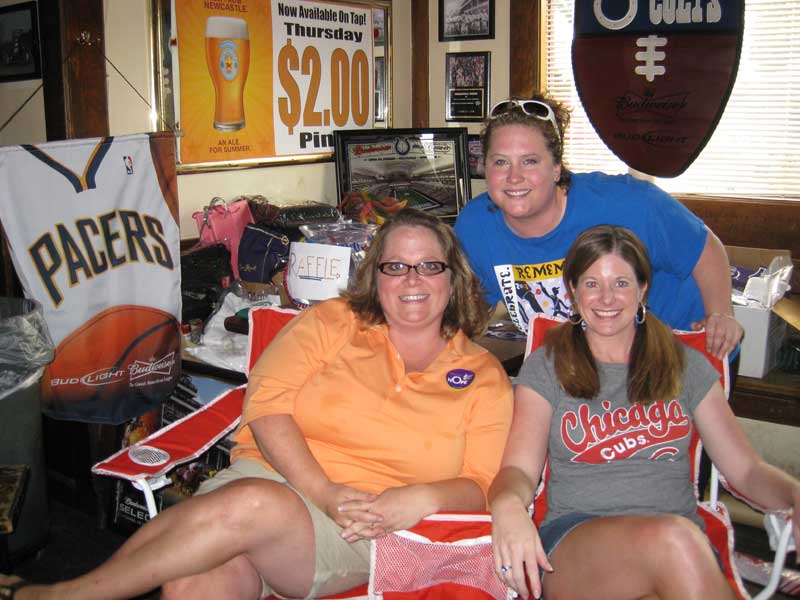 Katrina Schneider, Katie Kotarski, Sara Beaver at the raffle table at Connor's Pub.