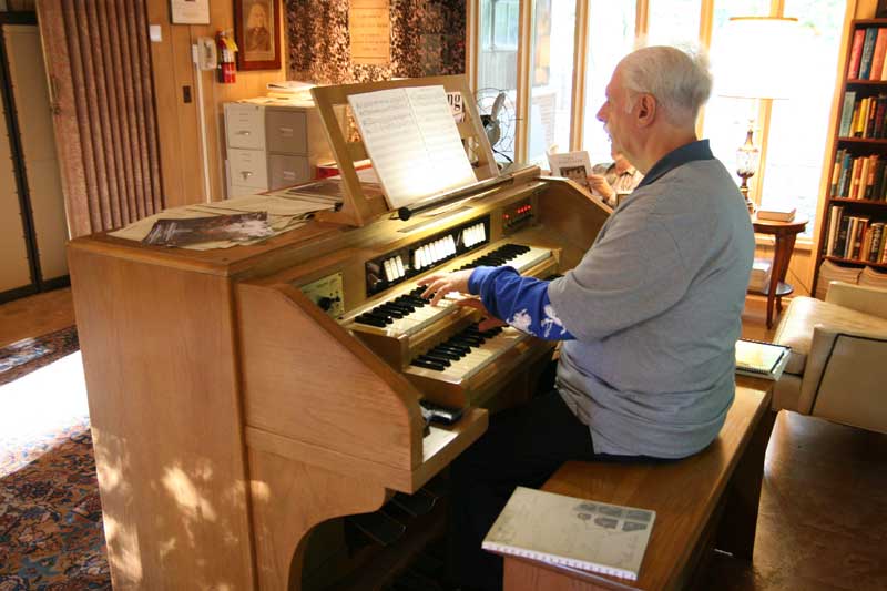 William Engle at the carillon keyboard in the carillon room of the Garden House