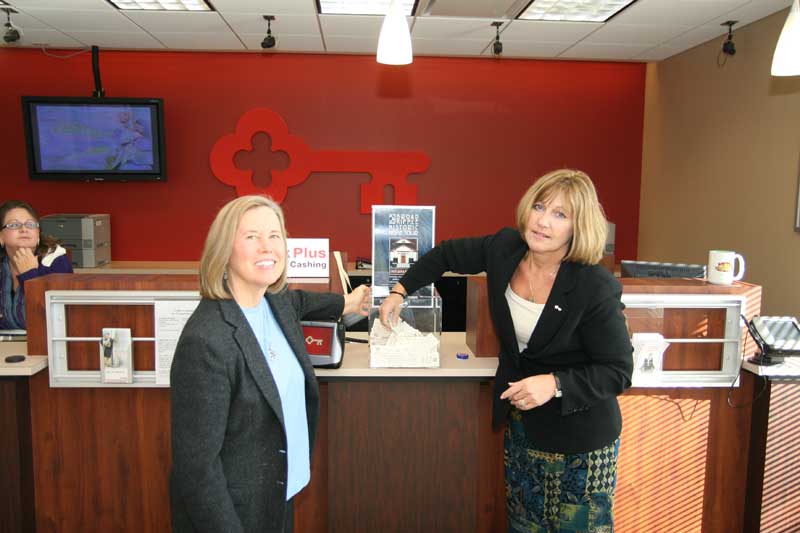 BRVA Executive Director Sharon Butsch Freeland looks on as KeyBank Manager Sara Hill draws a winning ticket stub