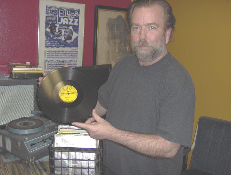 Rich Hynes displays a rare Sun Records LP found in his store.