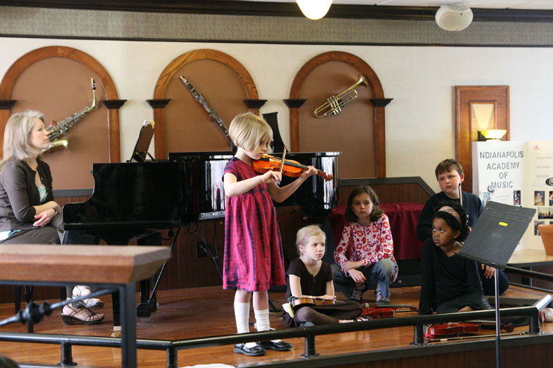 Katherine Jolliff played violin while other students of the academy looked on.