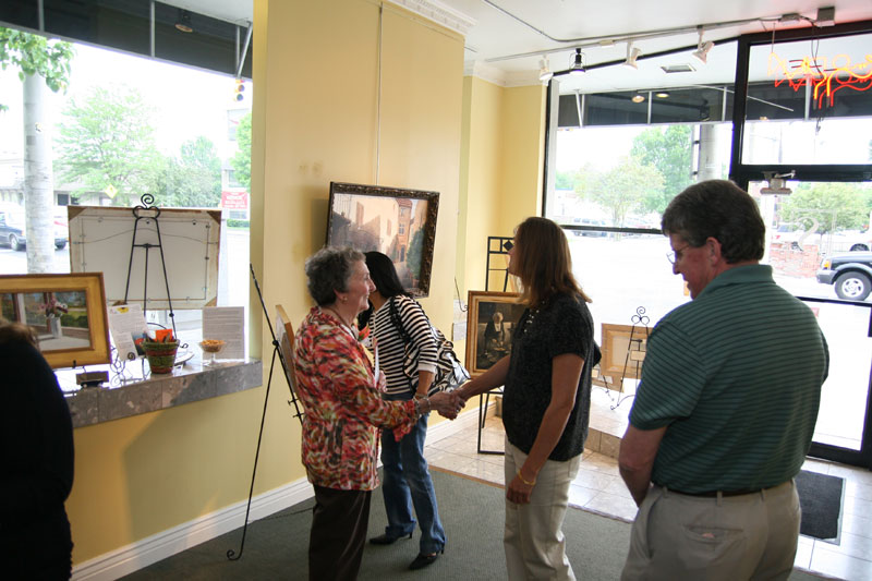Painter Betty Boyle meets tour attendees at Sigman's Gallery.