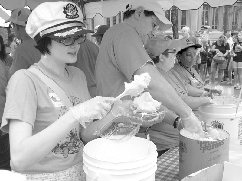 Dishing up the strawberries at the 2009 festival.