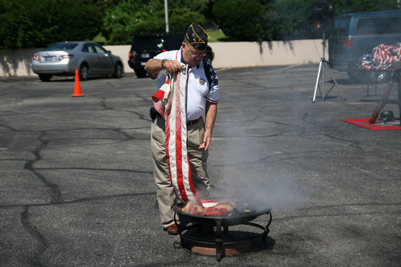 Mike Alhand properly retiring an unserviceable flag. The bulk of the unserviceable flags were retired with the help of Flanner and Buchanan, who also provided a free lunch for all attendees.