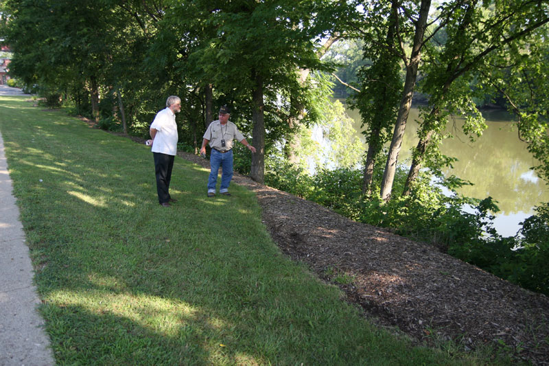 Tom Healy and John Hall inspecting the banks of the White River east of Applebee's.