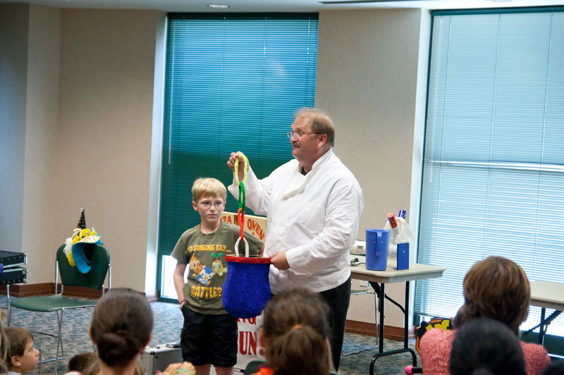 Jim Austin performed his magic show Cooking Up Fun to a standing-room-only crowd.