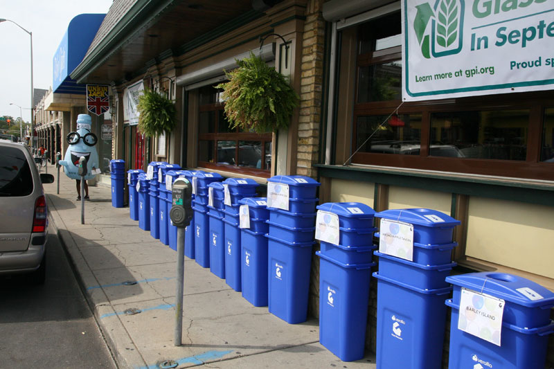 Stacks of bins (and a glass mascot!) outside Union Jack awaiting pickup by restaurants that pre-ordered them.