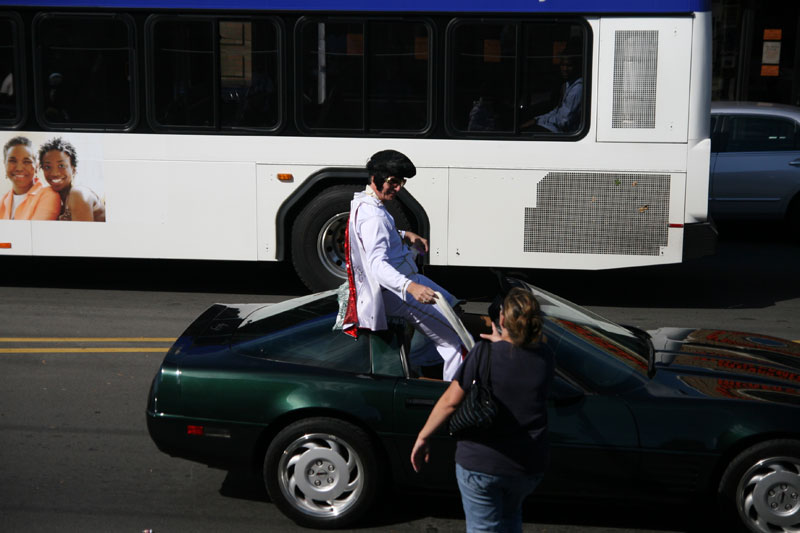 A love-struck fan grabs the scarf, Vegas-style, from Elvis Judd Presley at the Homecoming parade.