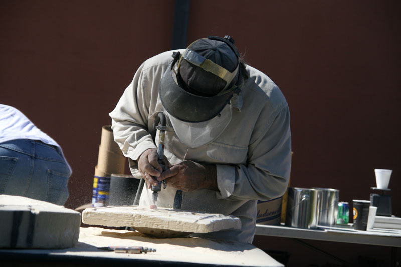 famed sculptor Hanna Jubran grinding a mold