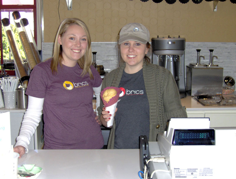BRICS General Manager Jessica Ralston & Nicki Matthews with a pumpkin flavor in a waffle cone.