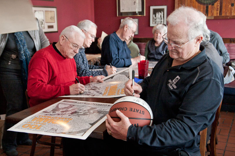 The team autographed items to support the museum.