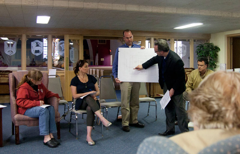 Showing the proposed plans for the new Scofield Editorial offices to the committee.