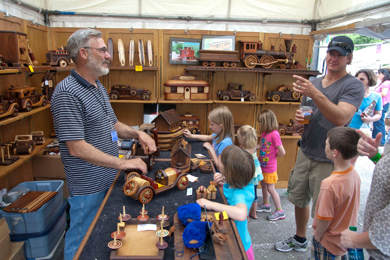 Steve Baldwin demonstrates a wood car available at his Baldwin Toys booth at the 2011 Broad Ripple Art Fair. These intricate pieces are a wonderful mixture of art, craftsmanship, toy, and puzzle. We wanted to stay and play all day!