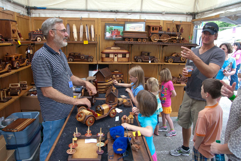 Steve Baldwin demonstrates a wood car available at his Baldwin Toys booth at the 2011 Broad Ripple Art Fair. These intricate pieces are a wonderful mixture of art, craftsmanship, toy, and puzzle. We wanted to stay and play all day!