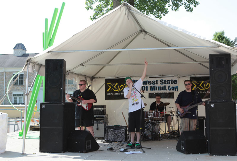 Andrew on rhythm guitar and vocals, Jay P. on bass, Sean on percussion, and Corey on lead guitar performed under the name 