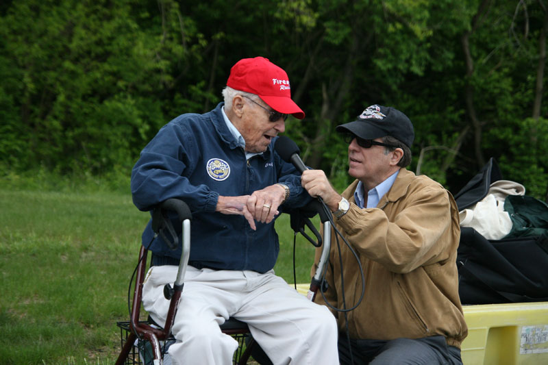 ESPN announcer Gary Lee interviewing 94-year-old race flagger Johnny Shipman.