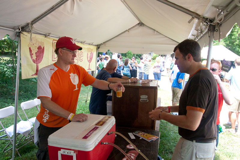 Hugh Vandivier hands out a sample from Brugge Brasserie.