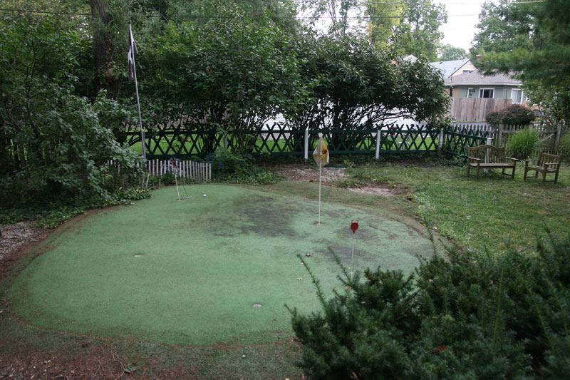 The home at 350 E. 60th Street features a putting green in the back yard with a replica fence from the 18th green at St. Andrews, Scotland.