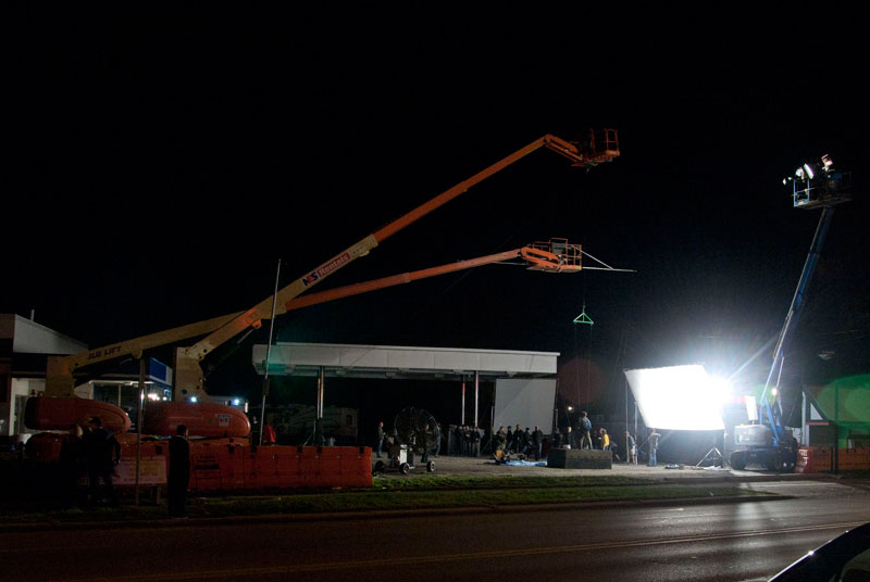 the actor is in a harness hanging from a crane