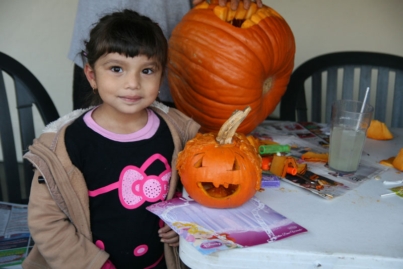 Adrianna poses with her happy jack-o-lantern.