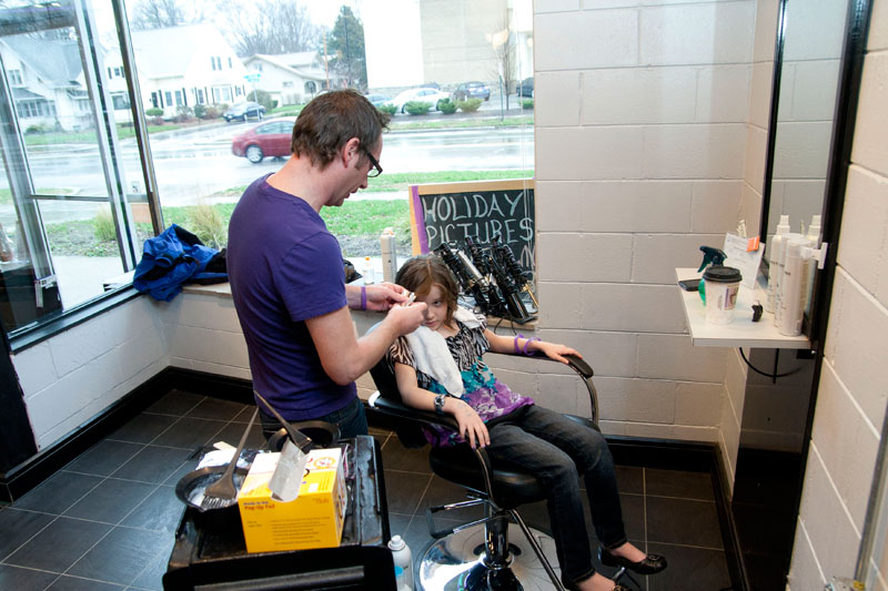 Owner Will Watson dying a purple streak in the hair of one of Kelsey's friends.