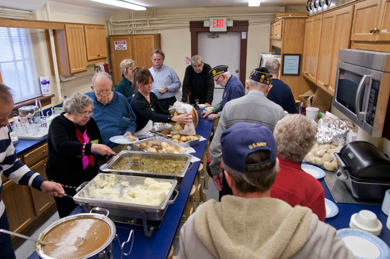 Attendees in the buffet line in the newly renovated kitchen.